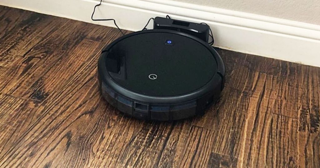 black robotic vacuum on charging base