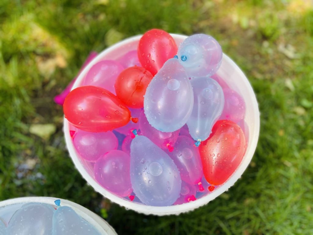 bucket full of water balloons