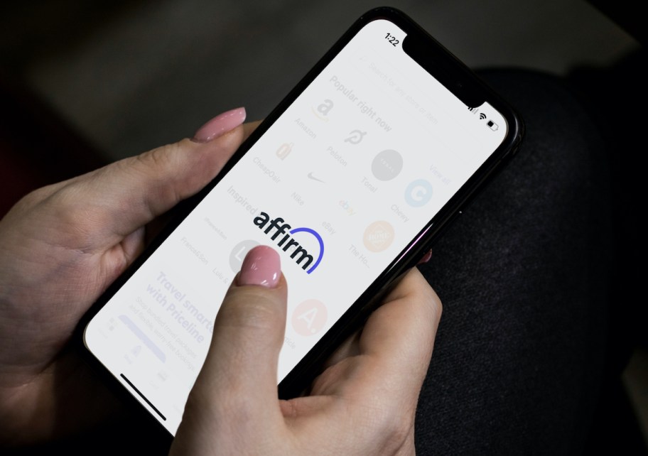 hands holding a phone with affirm app on screen to prepare for walmart black friday