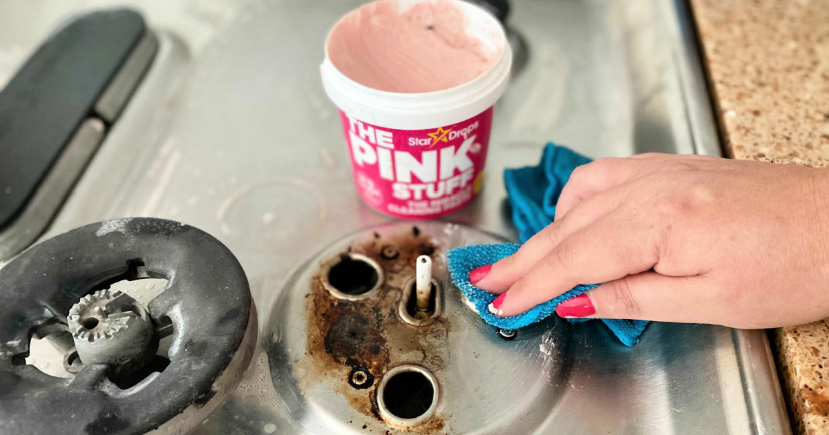 cleaning the stove with the pink stuff cleaner
