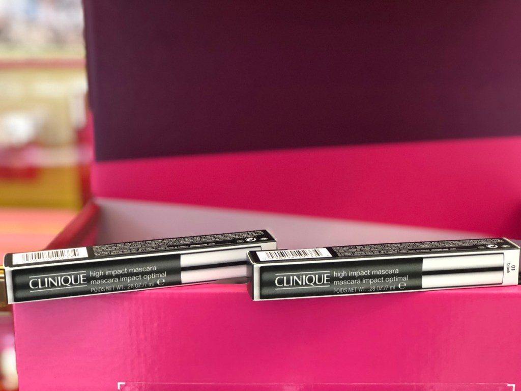 2 packages of unopened mascara on box at store