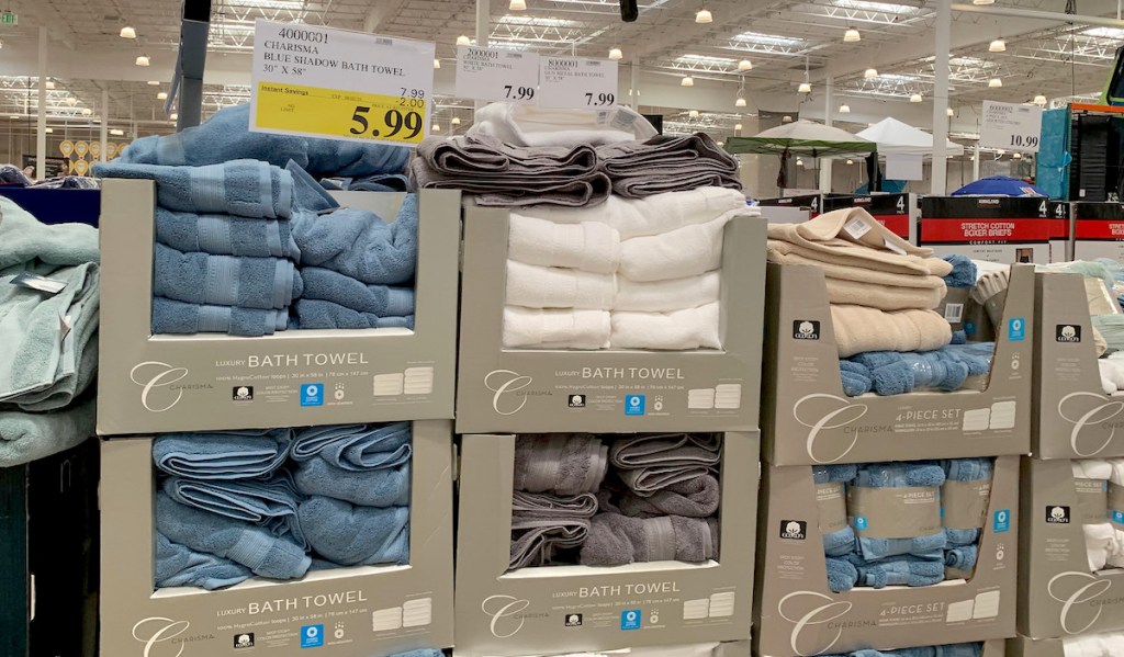 stacks of boxes of towels in store with price sign - what to buy costco