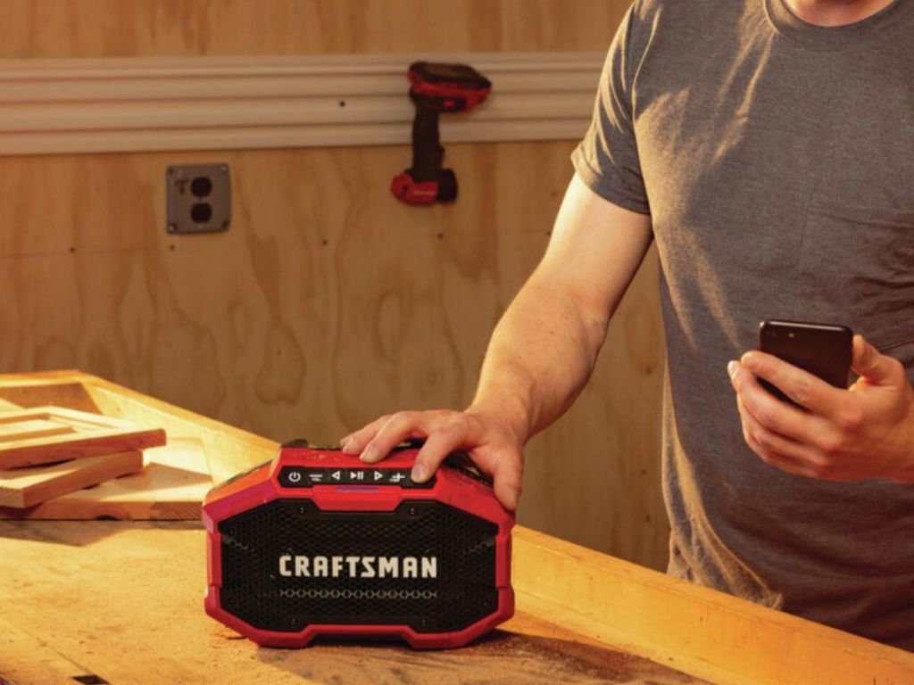 Craftsman radio on wood surface