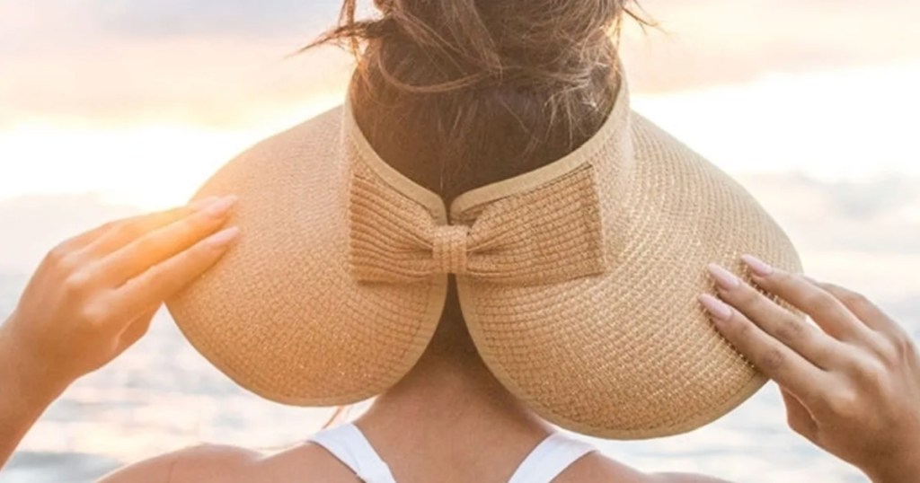 cute bow visor on woman head in sunset