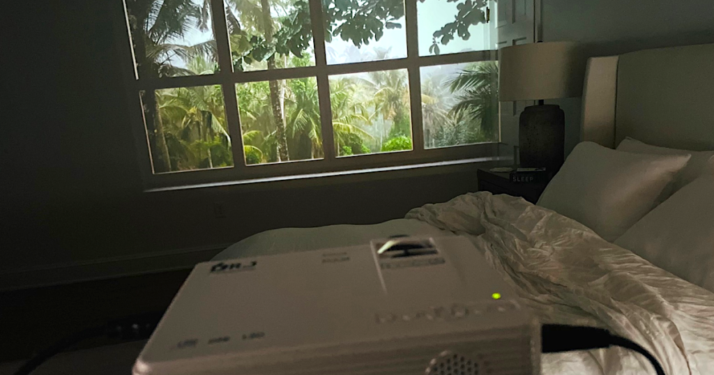 projector showing faux window with rainforest 