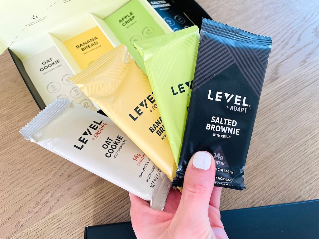 holding Level protein bars in hand 