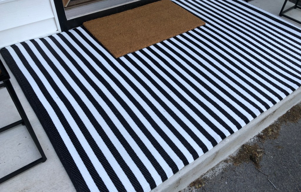 white and black striped outdoor rug