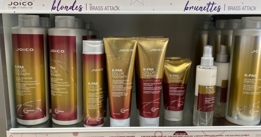 store display with hair productgs in gold and red bottles