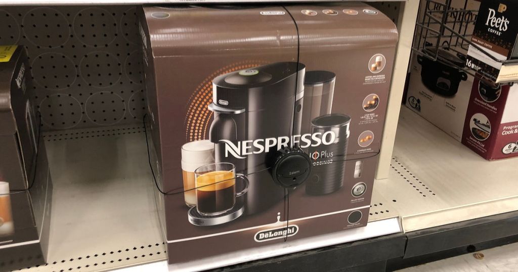 boxed Nespresso coffee maker on shelf
