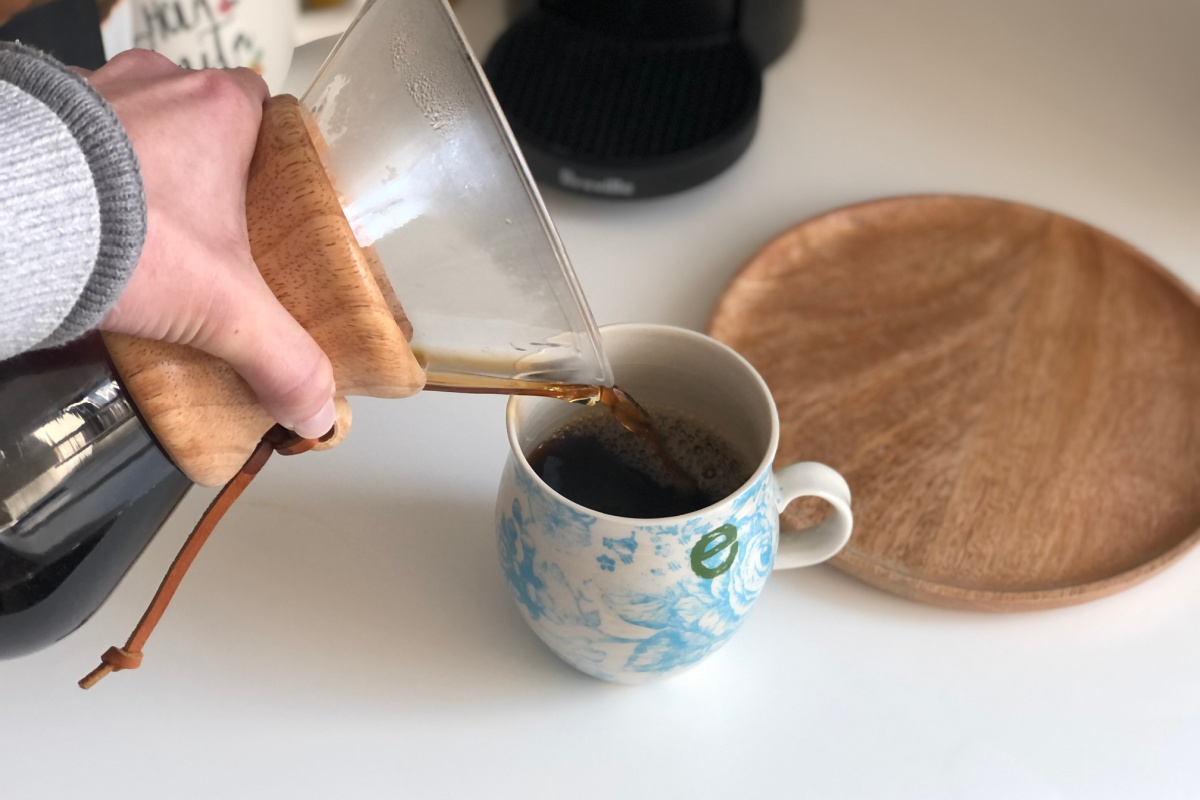 woman pouring coffee into mug