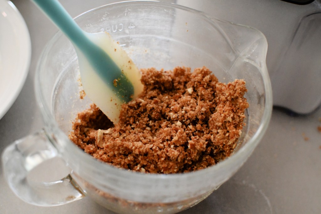 pretzel crumbs butter and sugar in a mixing bowl