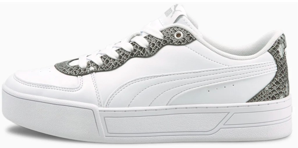 white and snake skin colored puma shoes