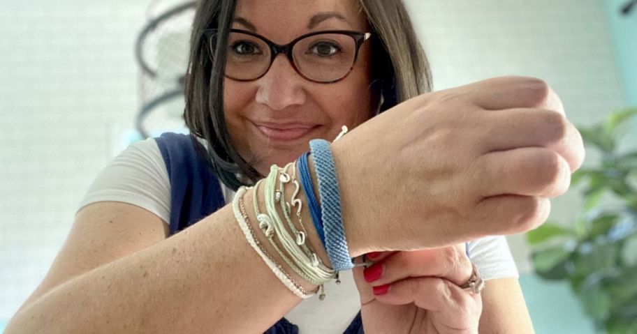 woman wearing pura vida bracelets