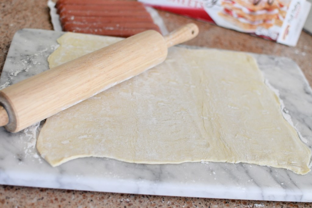 rolling out puff pastry with rolling pin