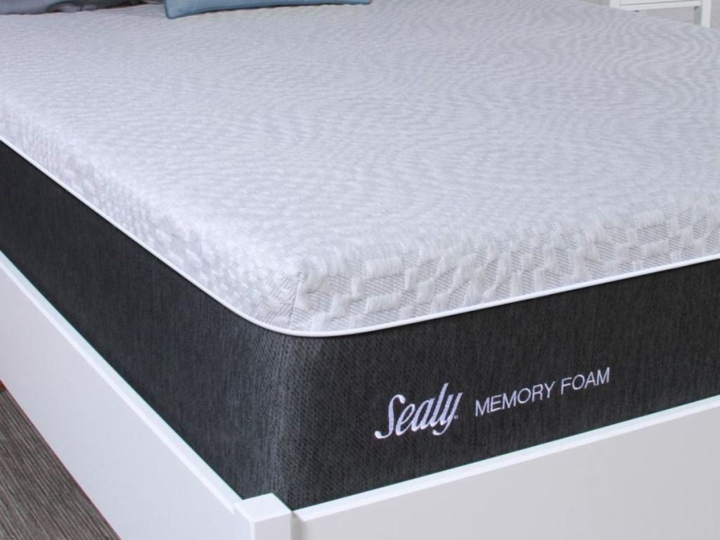 Sealy mattress on bed