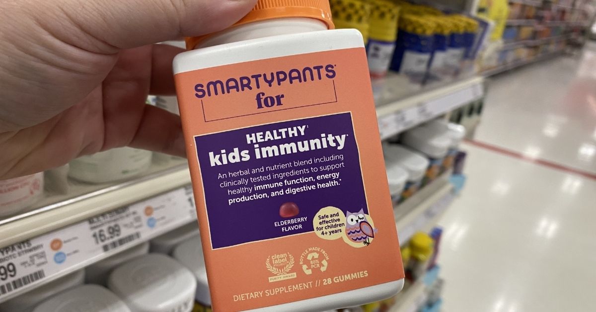 hand holding SmartyPants kids Vitamins