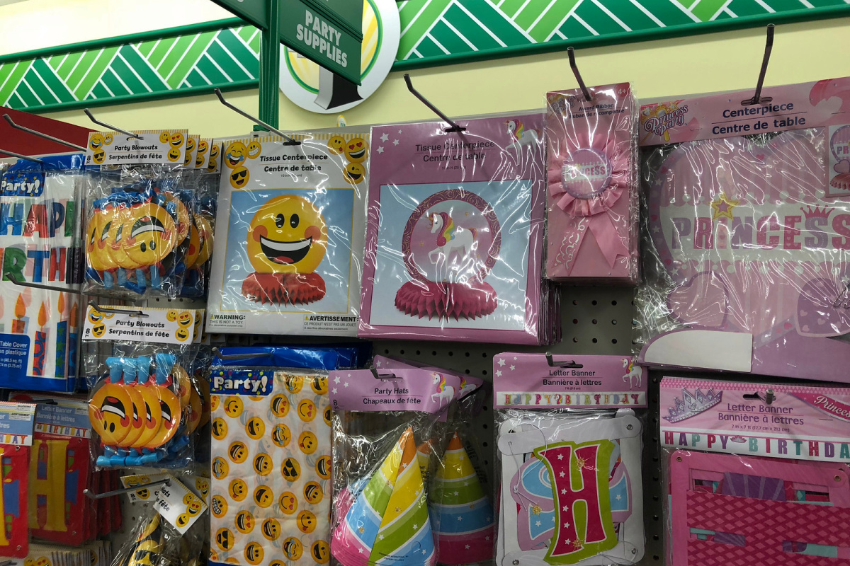 unicorn birthday party supplies and goody bags hanging in store