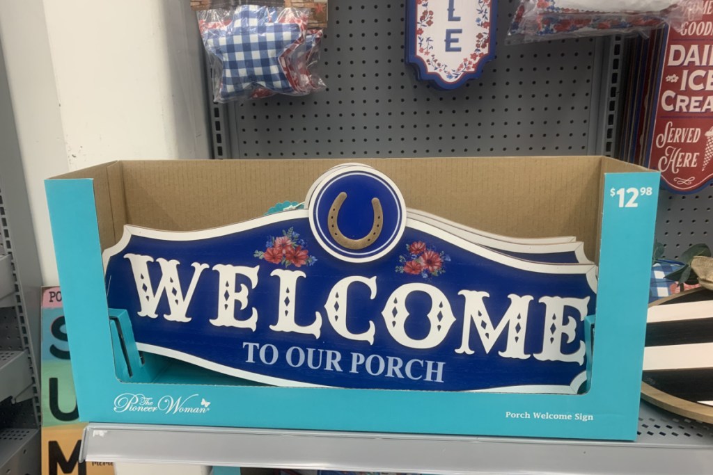 welcome sign in blue box in front of other summer decorations