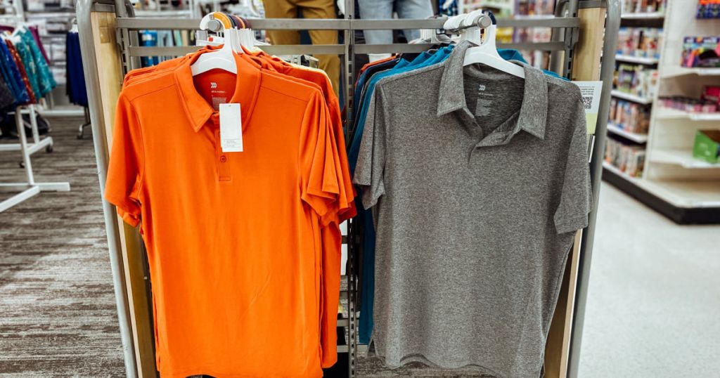 orange and grey polo on rack 