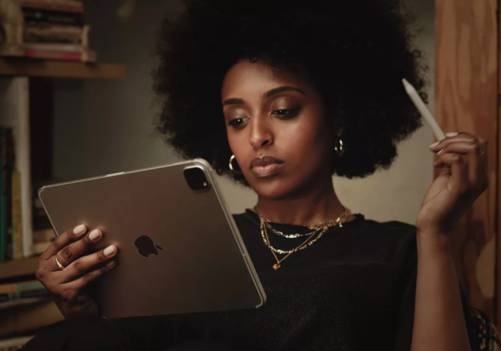 woman holding an Apple iPad
