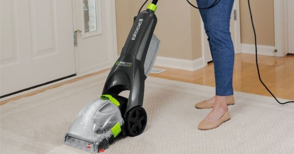 woman using a Bissell Carpet Cleaner