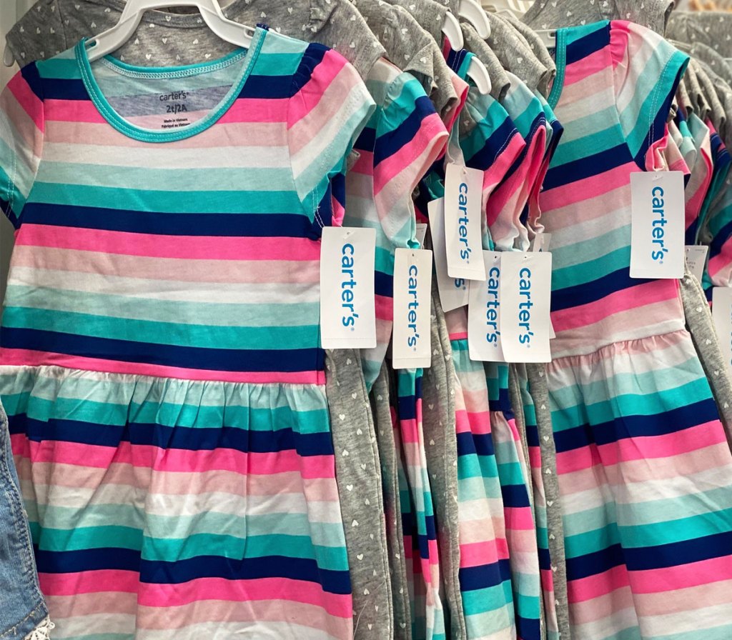striped girls dresses on hangers