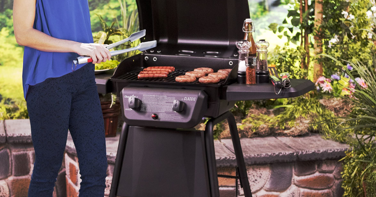 woman standing next to a char-broil grill