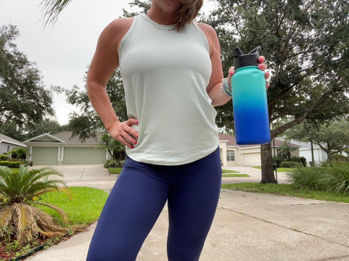 woman holding a water bottle