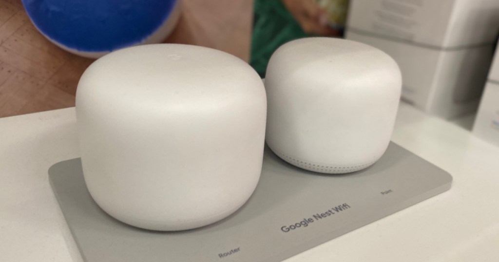 two white round routers on shelf