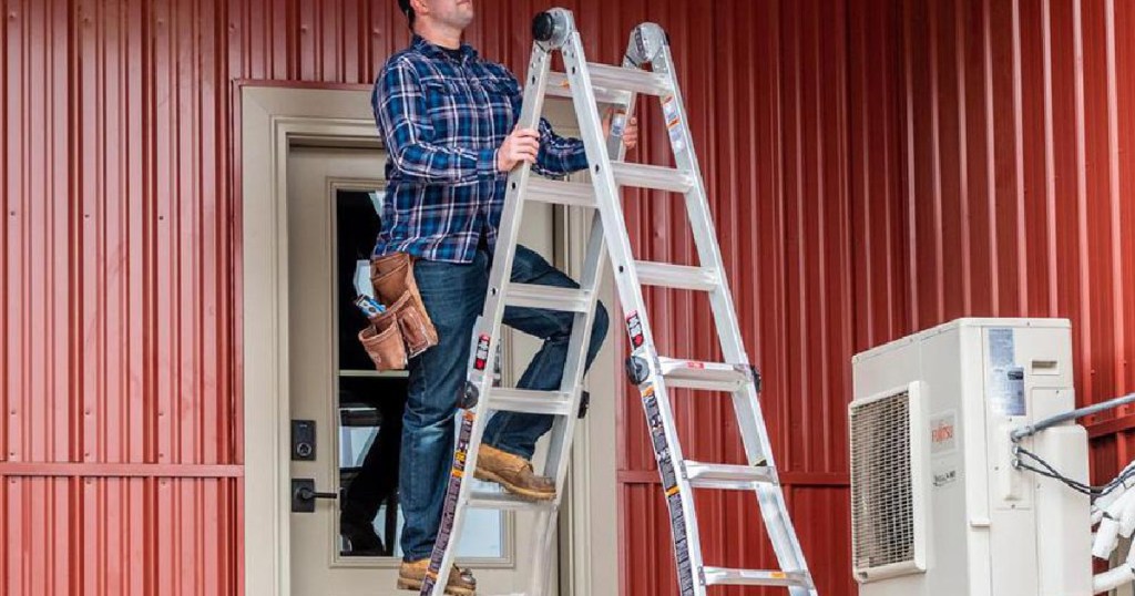 man on ladder outside building