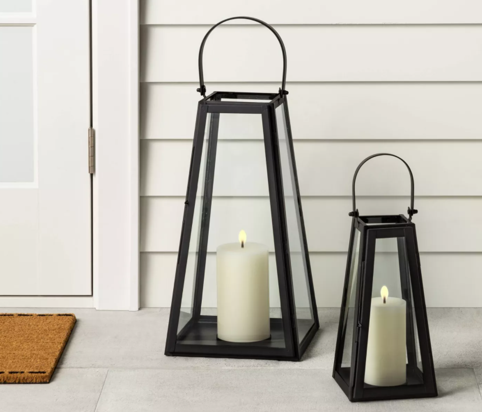 two metal lanterns by a door