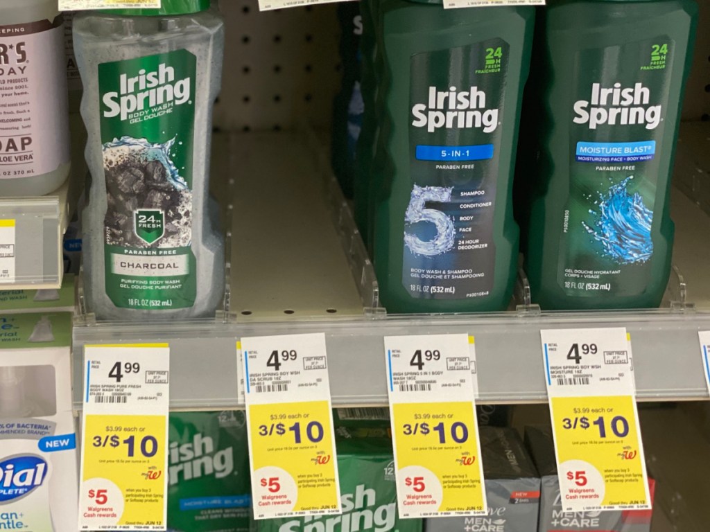 bottles of body wash and sale signs on store shelf