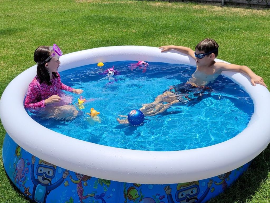 two kids in an inflatable kiddie pool
