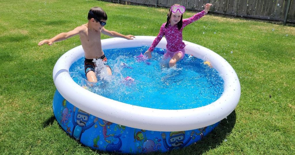 two kids in an inflatable kiddie pool