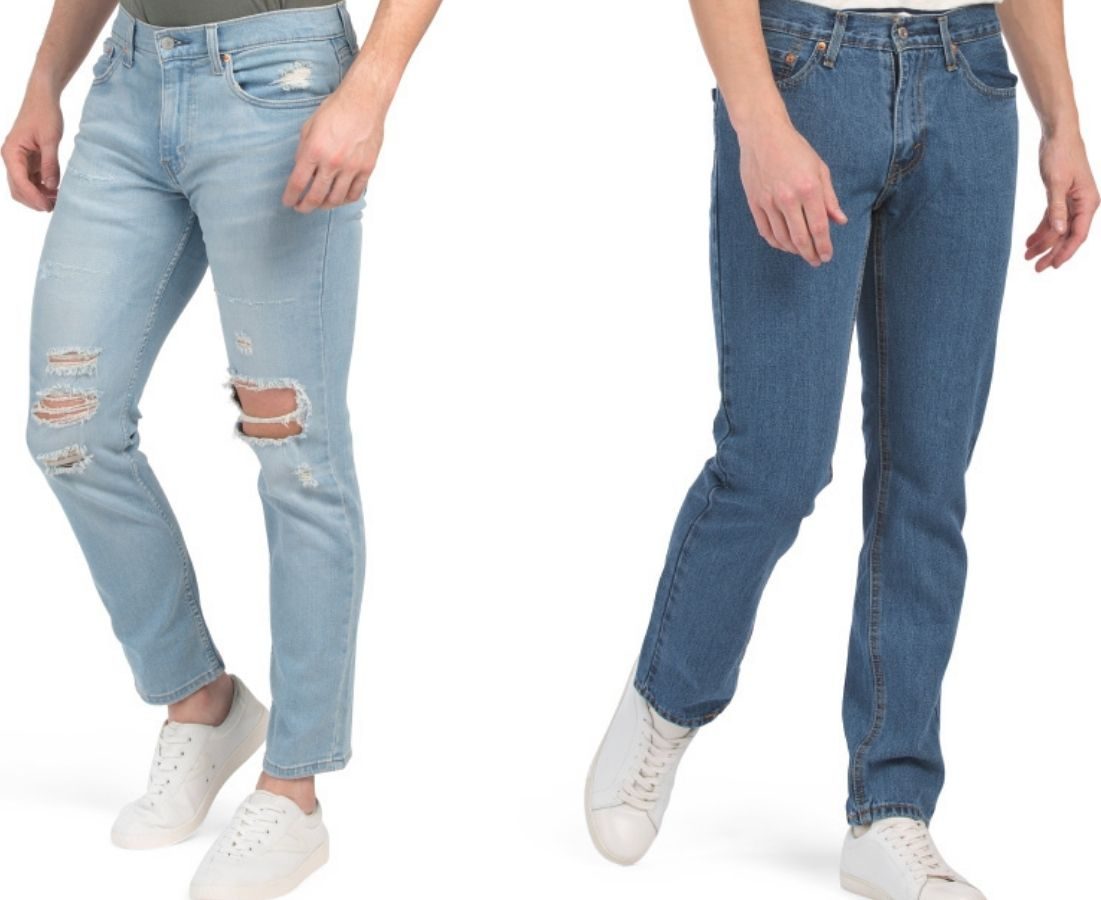 two men wearing jeans