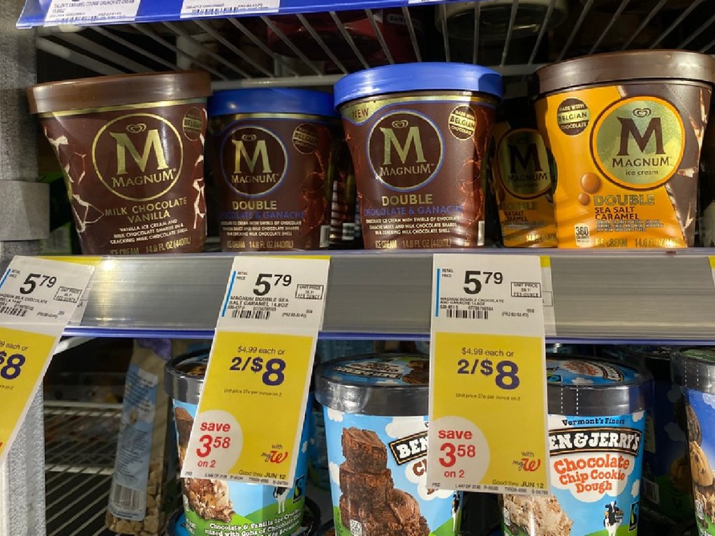 pints of different flavored ice cream in store freezer