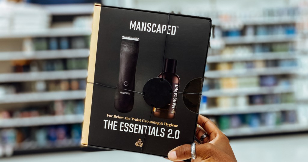 hand holding black box of men's grooming essentials 