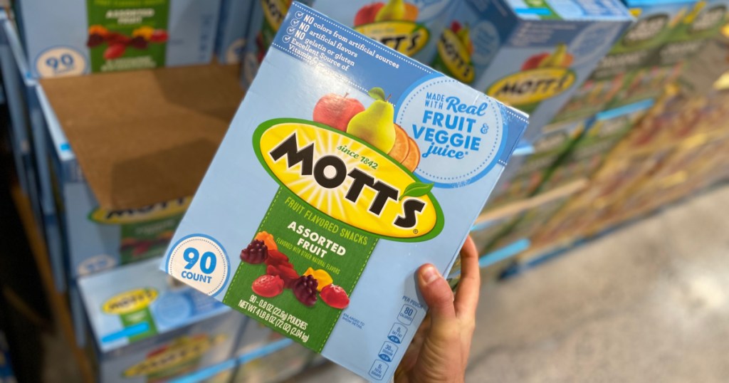 Hand holding huge box of Mott's fruit snacks