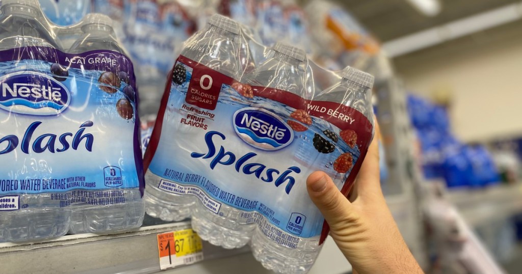 hand pulling pack of Nestle Splash Water off shelf