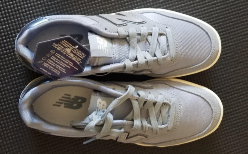 pair of grey New Balance Sneakers
