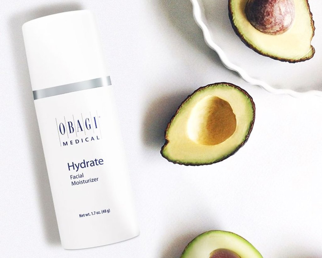 bottle of obagi moisturizer next to avocados