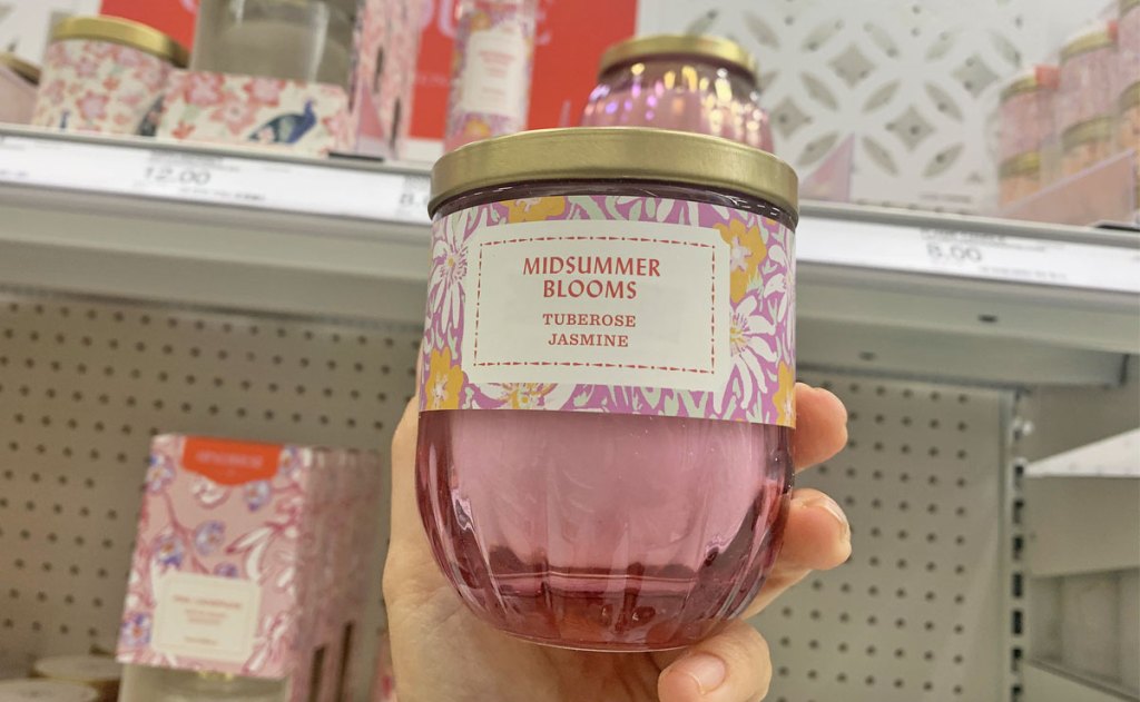 hand holding up pink candle at Target