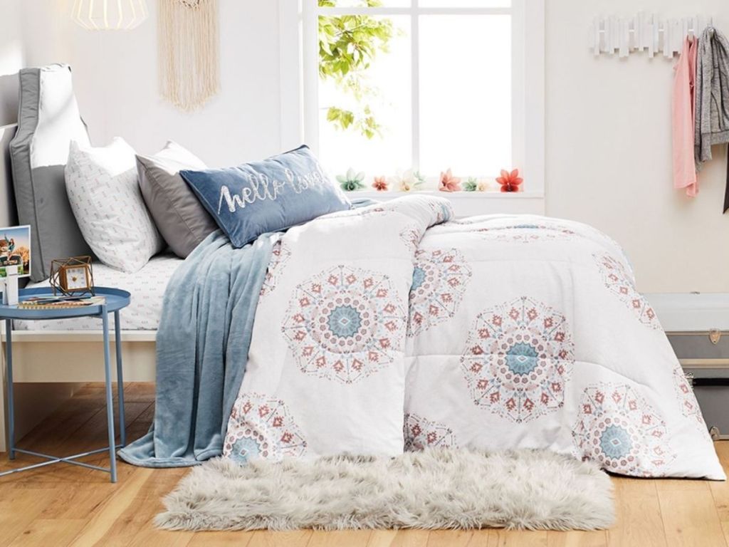 bedroom set with white, coral and blue themed bedding 