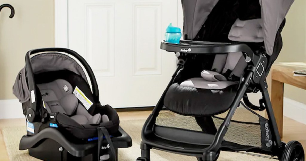 gray baby car seat and stroller in front of door 
