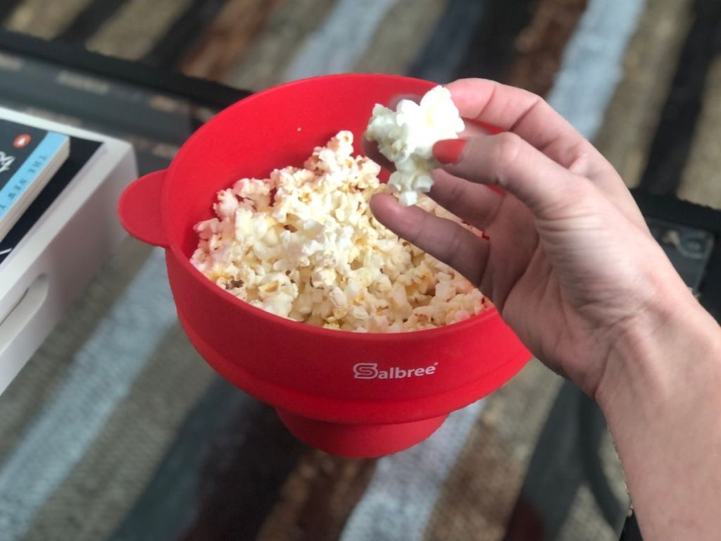 hand holding popcorn