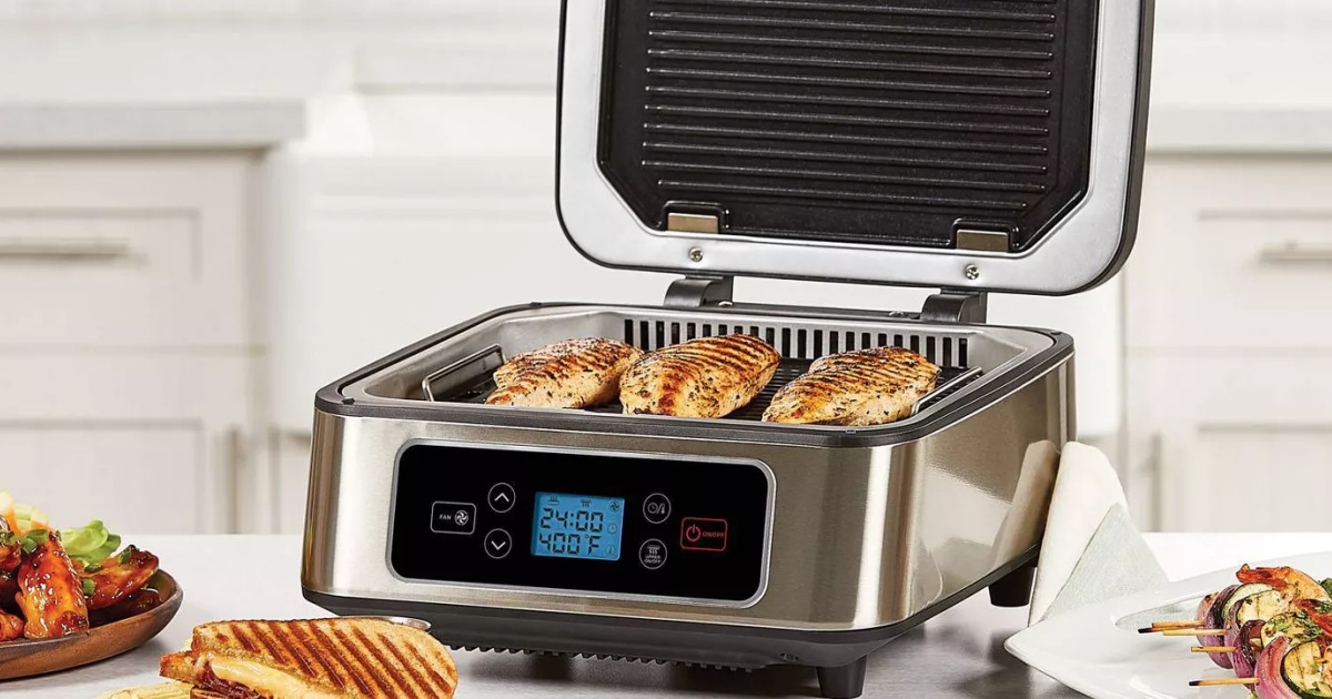 Shaq Smokeless Grill and Press on counter with chicken breasts