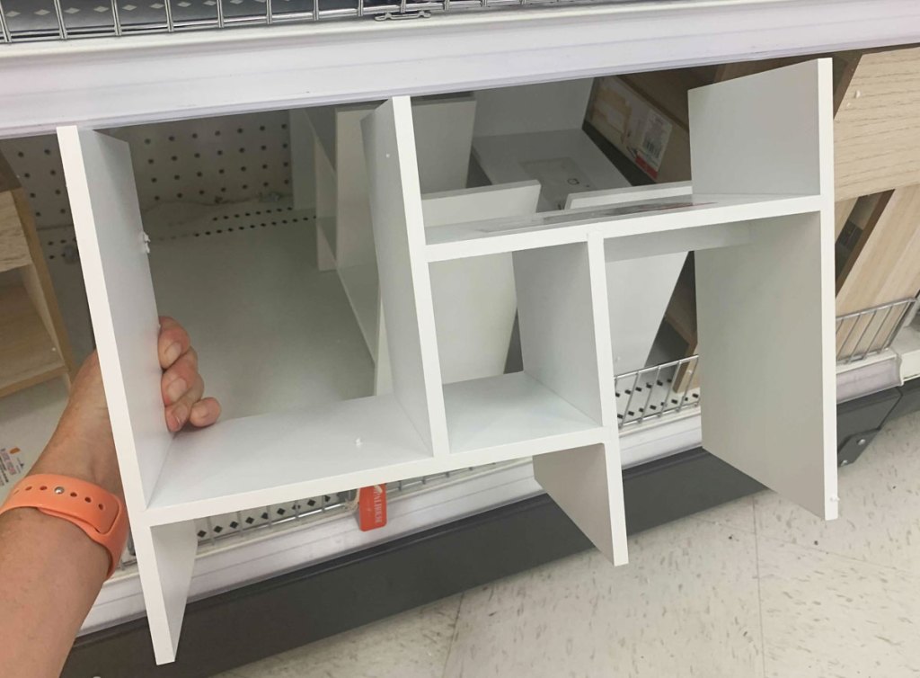 hand holding white desk organizer shelf at target
