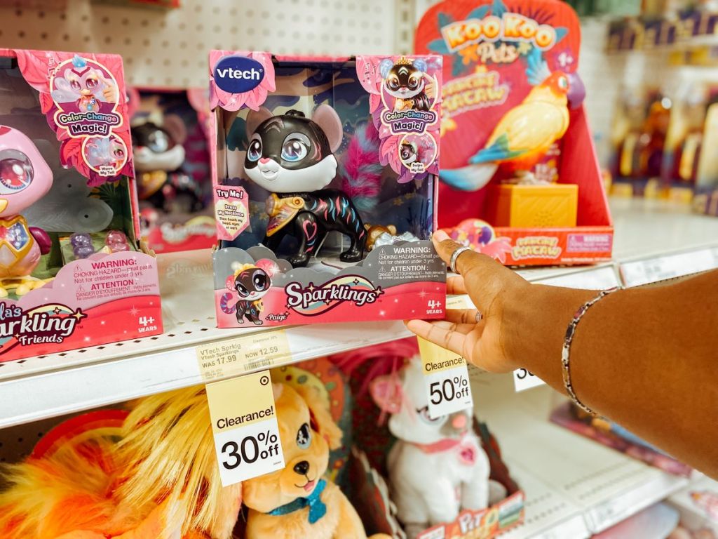 hand holding a VTech Sparklings Paige The Tiger box