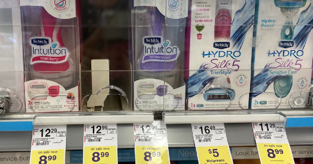 women's razors on store shelf with sale tags