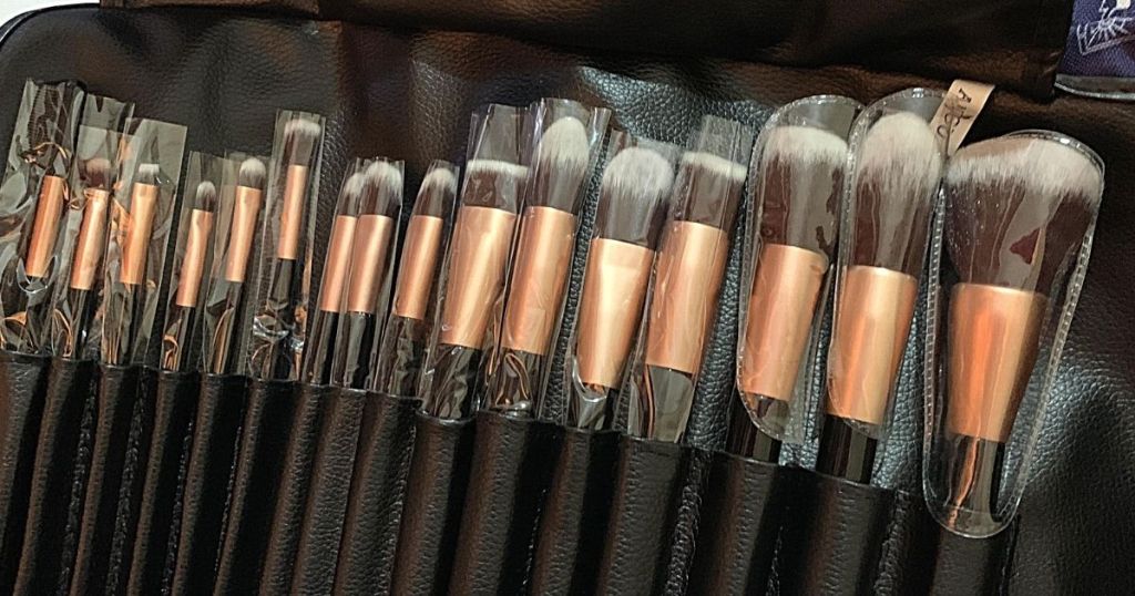 lots of makeup brushes in black case
